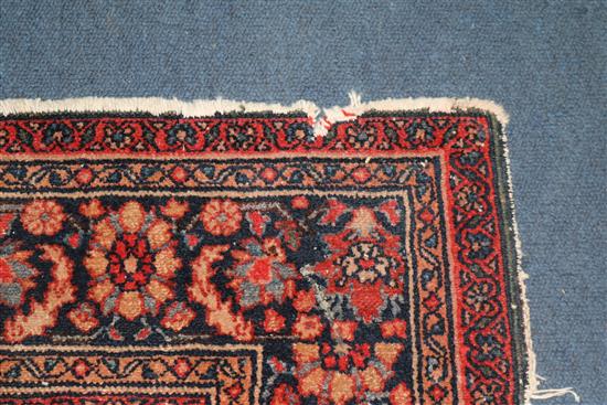 A Persian red ground rug 194 x 137cm